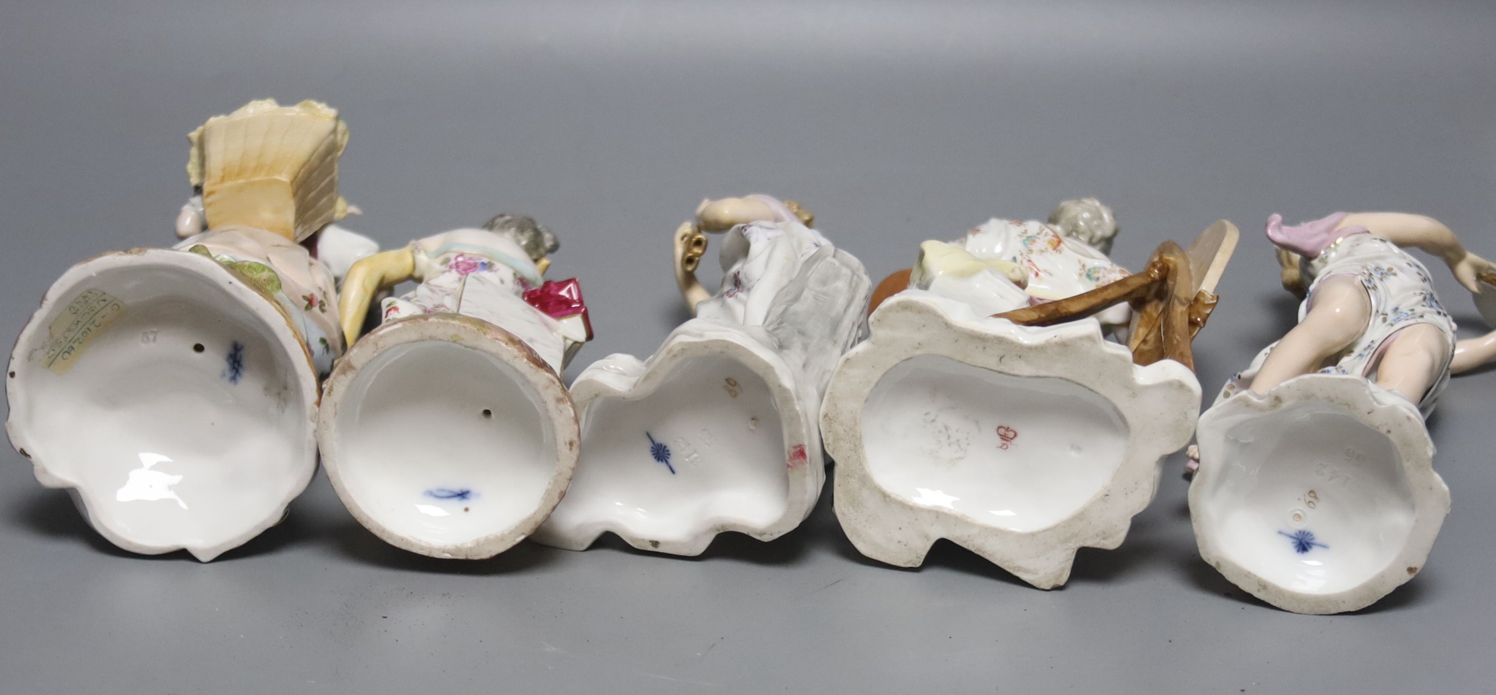 A pair of German musical figurines and three other similar figurines, tallest 23cm